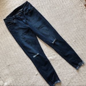 Raw hem skinny jeans with ripped knee
